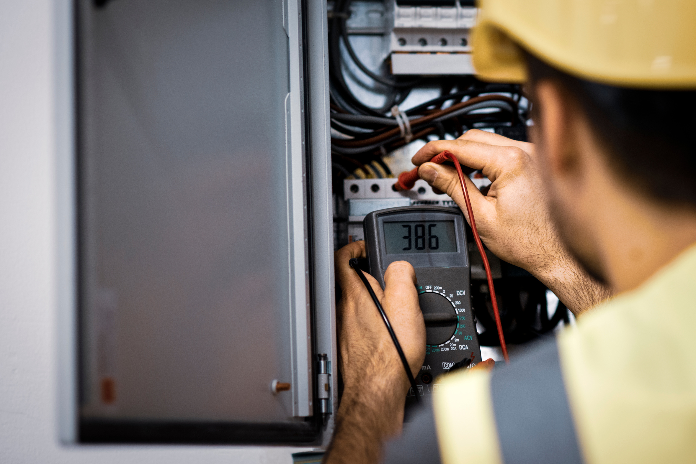 Electrician repairing electric panel